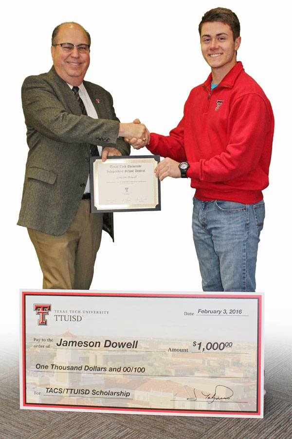 Dr. Jim Taliaferro awards Jameson Dowell with scholarship.