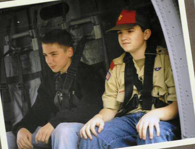 Christopher Chapman on a military helicopter over Kuwait, wearing Boy Scouts uniform.