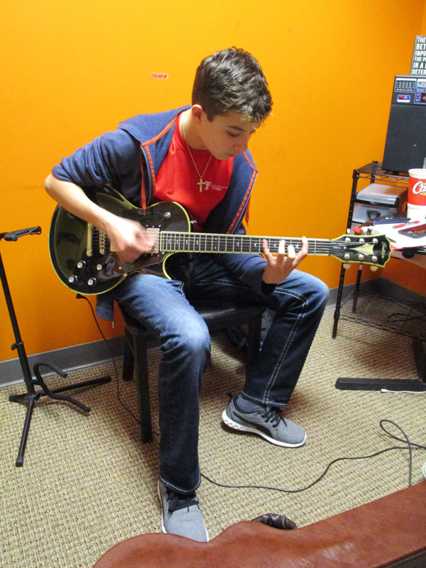 Austin's guitar lesson with coach Carlo Decanini.