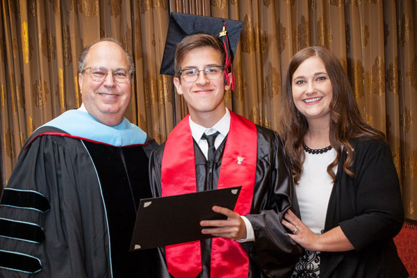 Joshua with Dr. James Taliaferro, superintendent; and Cari Moye, principal.