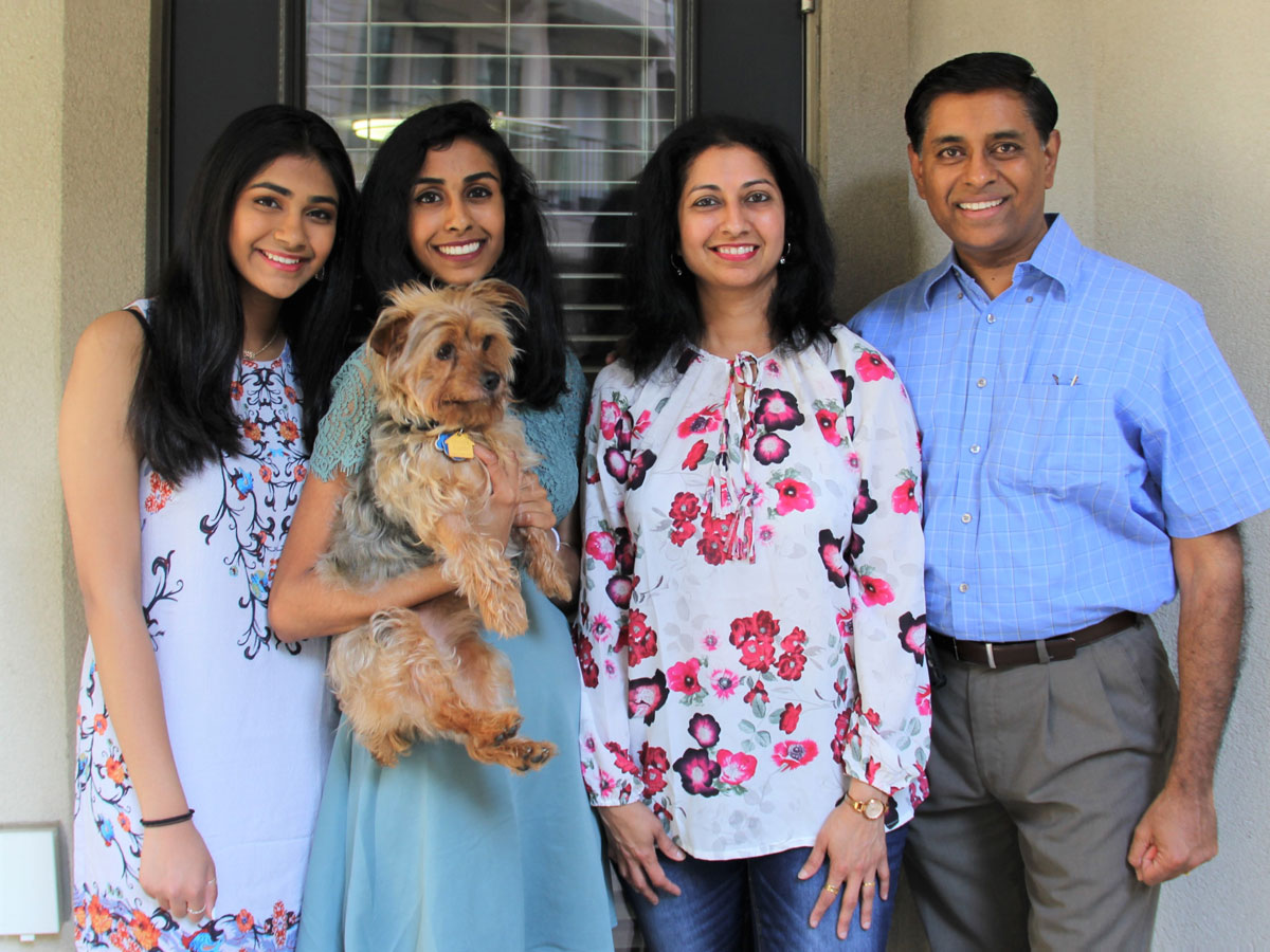 Mohana (left) with older sister Sahana and family pet Max; mother Saipriya and father Manjeri Krishnan. Mohana (left) with older sister Sahana and family pet Max; mother Saipriya and father Manjeri Krishnan.