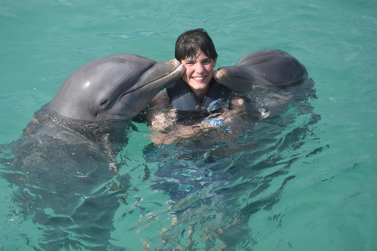 Wesley swimming with dolphins on a family trip to the Dominican Republic. Wesley swimming with dolphins on a family trip to the Dominican Republic.
