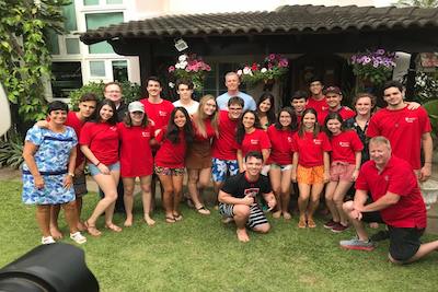 Dr. Justin Louder, Jared Lay and Jeff Oldham pose alongside TTU K-12 graduates in Brazil.