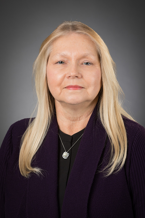 A headshot of Sharon Andrew