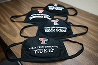TTU K-12 masks stacked above one another