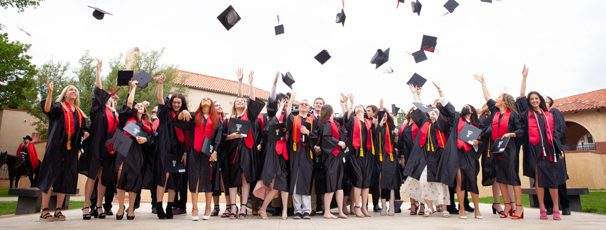 2021 TTU K-12 Graduates throwing mortar boards in the air after the commencement ceremony.