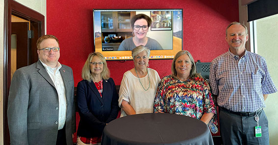 TTU K-12 Advisory Board. Standing together, from left to right, Interim Superintendent Justin Louder, Stacy Hobbs, Margaret Leifeste, Kayla Morrison and Doyle Vogler. On a monitor on the wall via Skype, Syd Sexton.