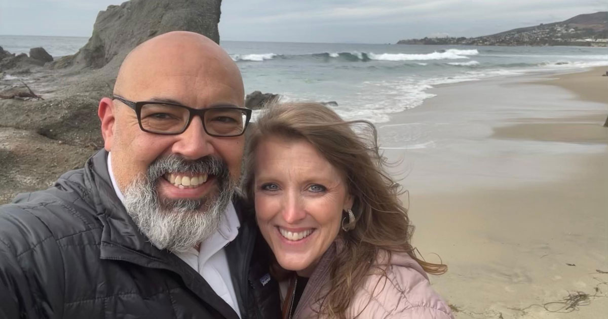 Jennifer and her husband Michael, who enjoy traveling, pose at Long Beach, Ca.  