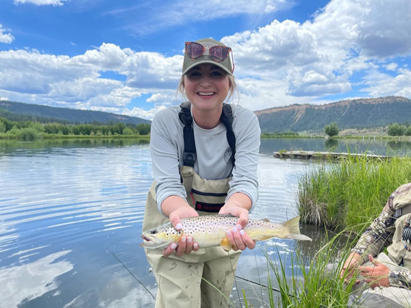 Madison Landreth holding caught fish.