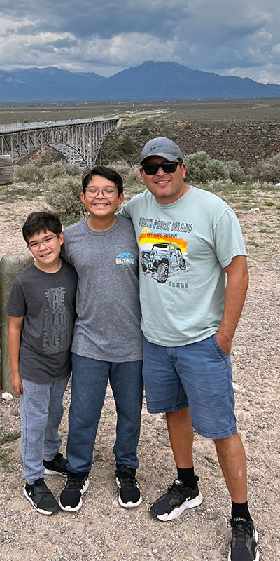 Richard Vasquez with his sons at the Rio Grande Gorge Bridge.