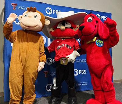 Raider Red hangs out with Clifford and Curious George at the PBS Kids event.