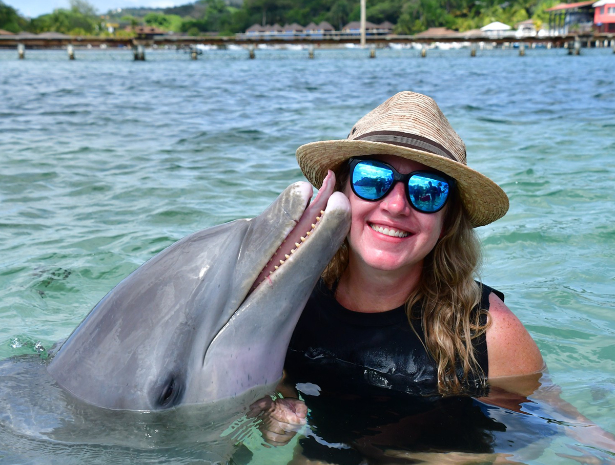 Keetha Chadwick befriends a dolphin in Roatan, Honduras.