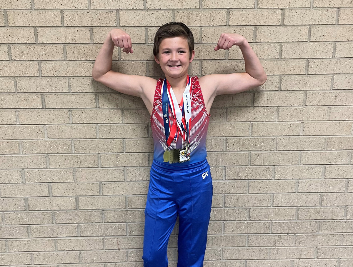 Eli shows off his medals.