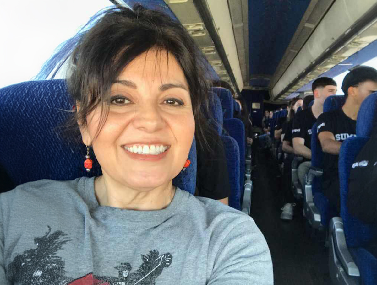 Diane Patrick, Texas Tech K-12 recruitment and international partnerships program manager, documents the students' arrival at the airport and on the bus.
