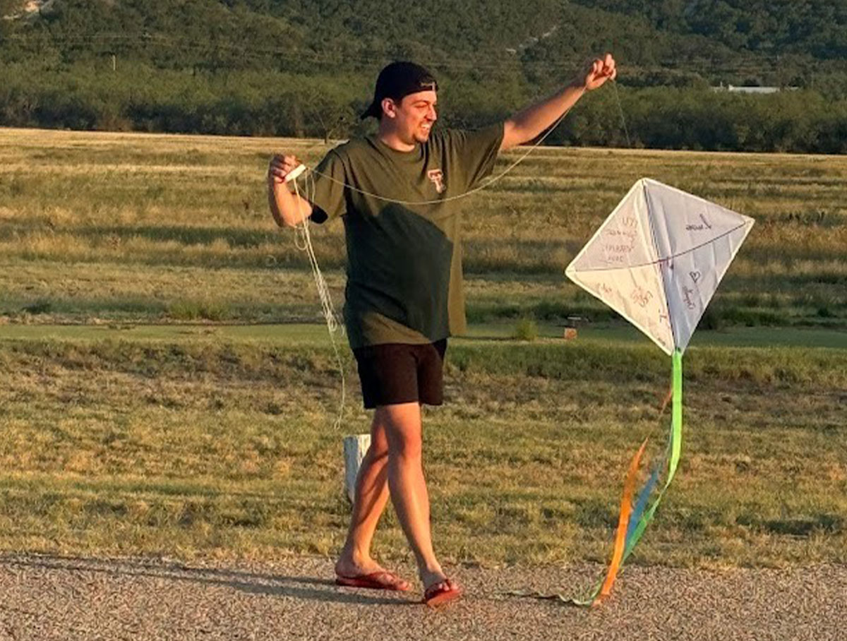 Group leader Lucas Fernandes flies a kite for the first time.