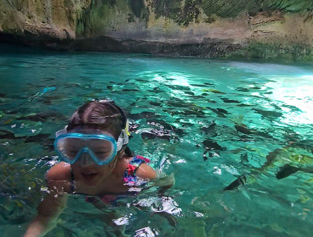 Sierra snorkels in the Thunderball Grotto in the Bahamas.