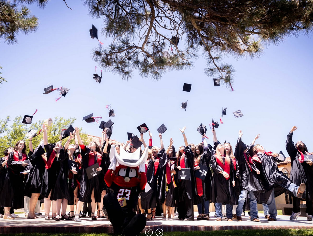 2024 graduates tossing their hats