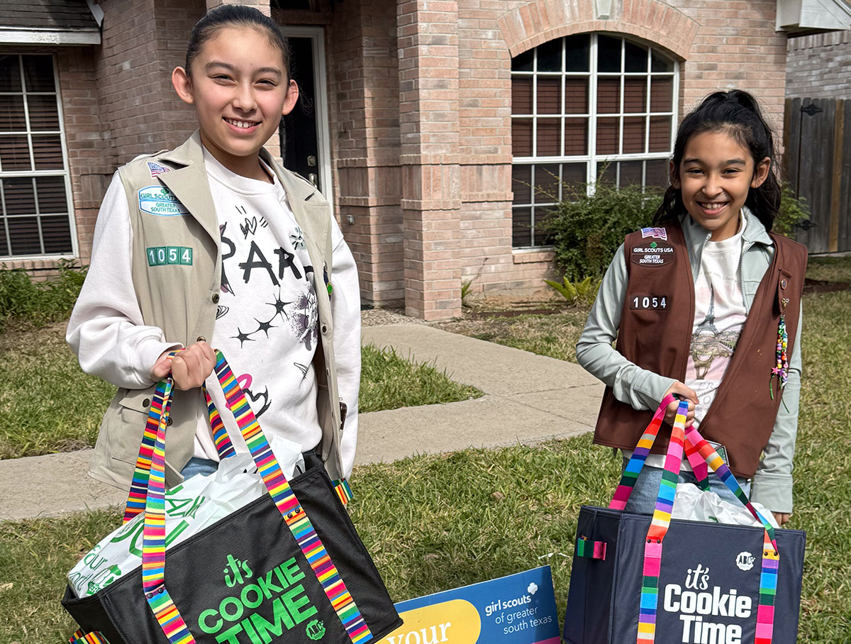 Joy, left, and her sister, Sol, participate in Girl Scouts.