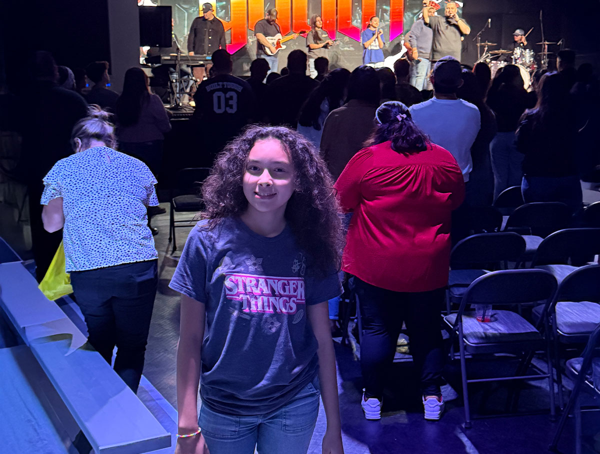 Joy takes breaks from dance to participate in her youth group.