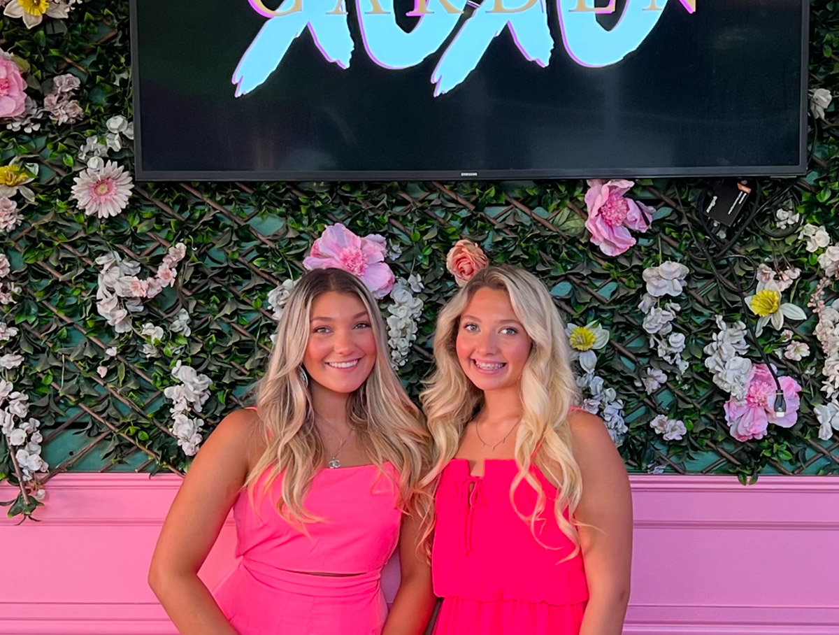 Torri, left, pictured with her older sister Ashley, loves bright pink, as it reflects her fun personality
