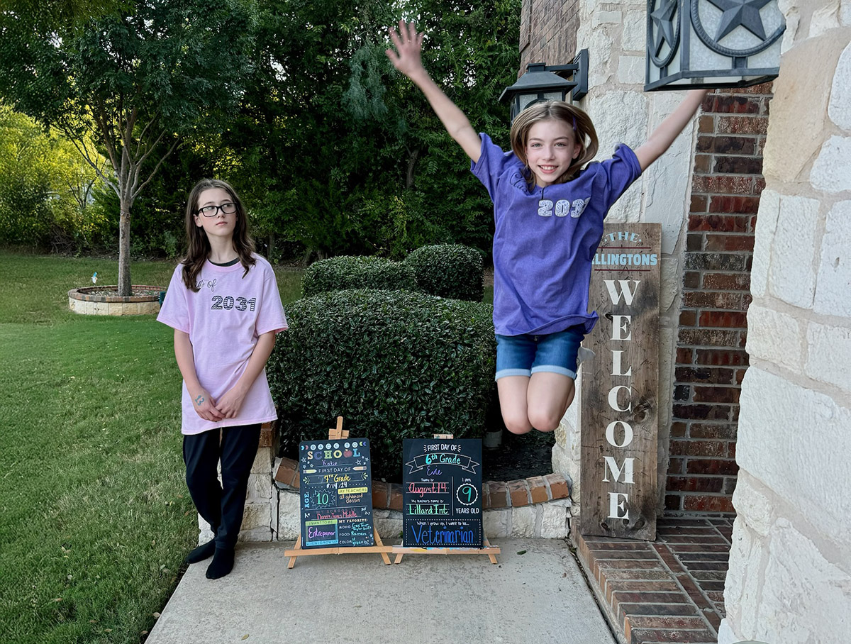 Back to school jump 24-25.JPG (Caption: Evie, pictured with sister Katie, jumps for joy for this school year.)