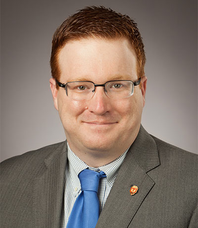 A headshot of Justin Louder.