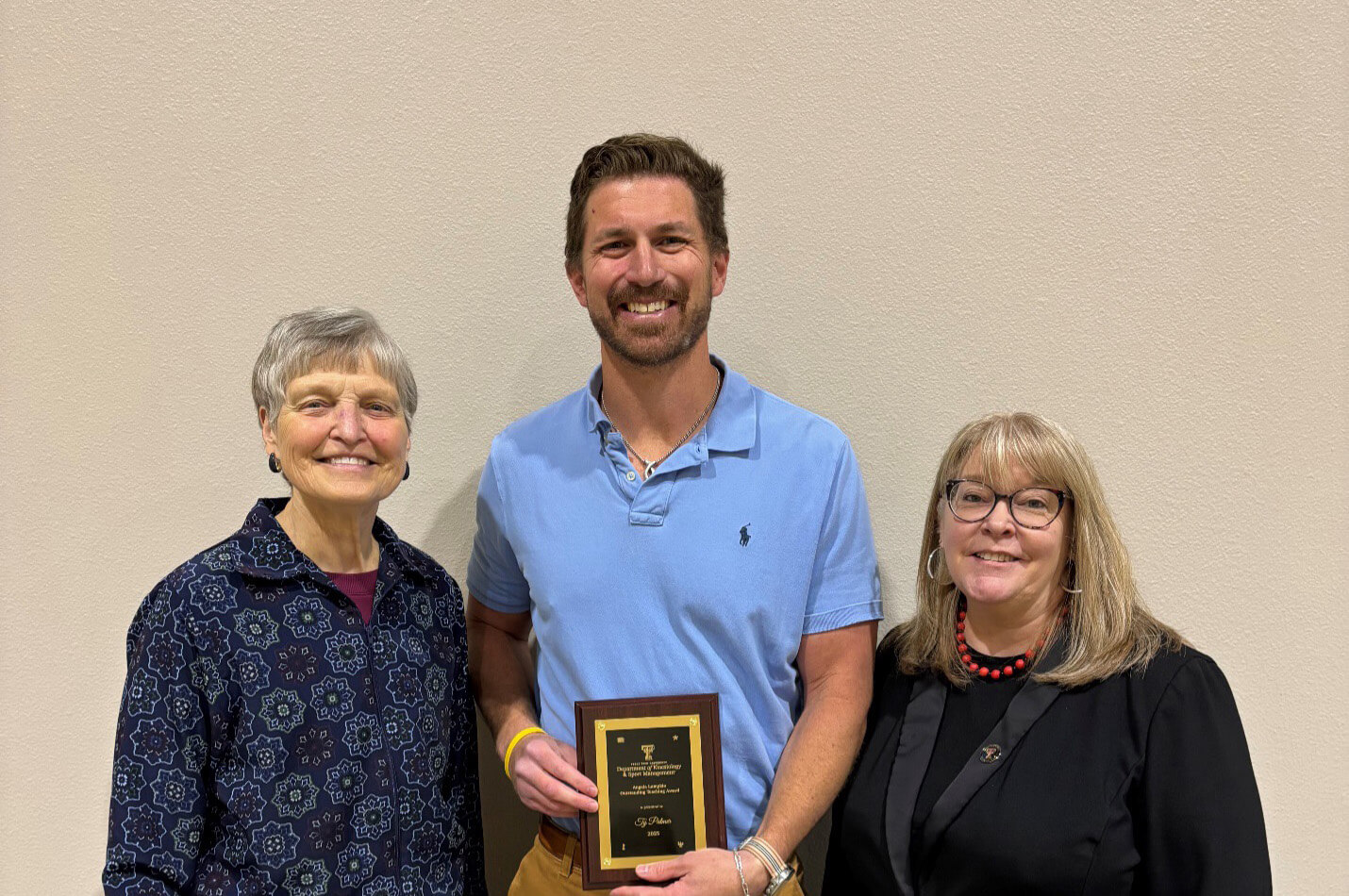 Ty Palmer received the Angela Lumpkin Outstanding Teaching Award in 2025
