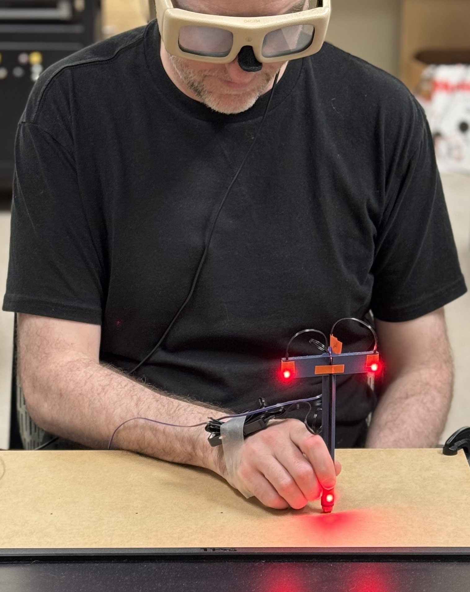 Jarrod Blinch demonstrating an experiment in his lab