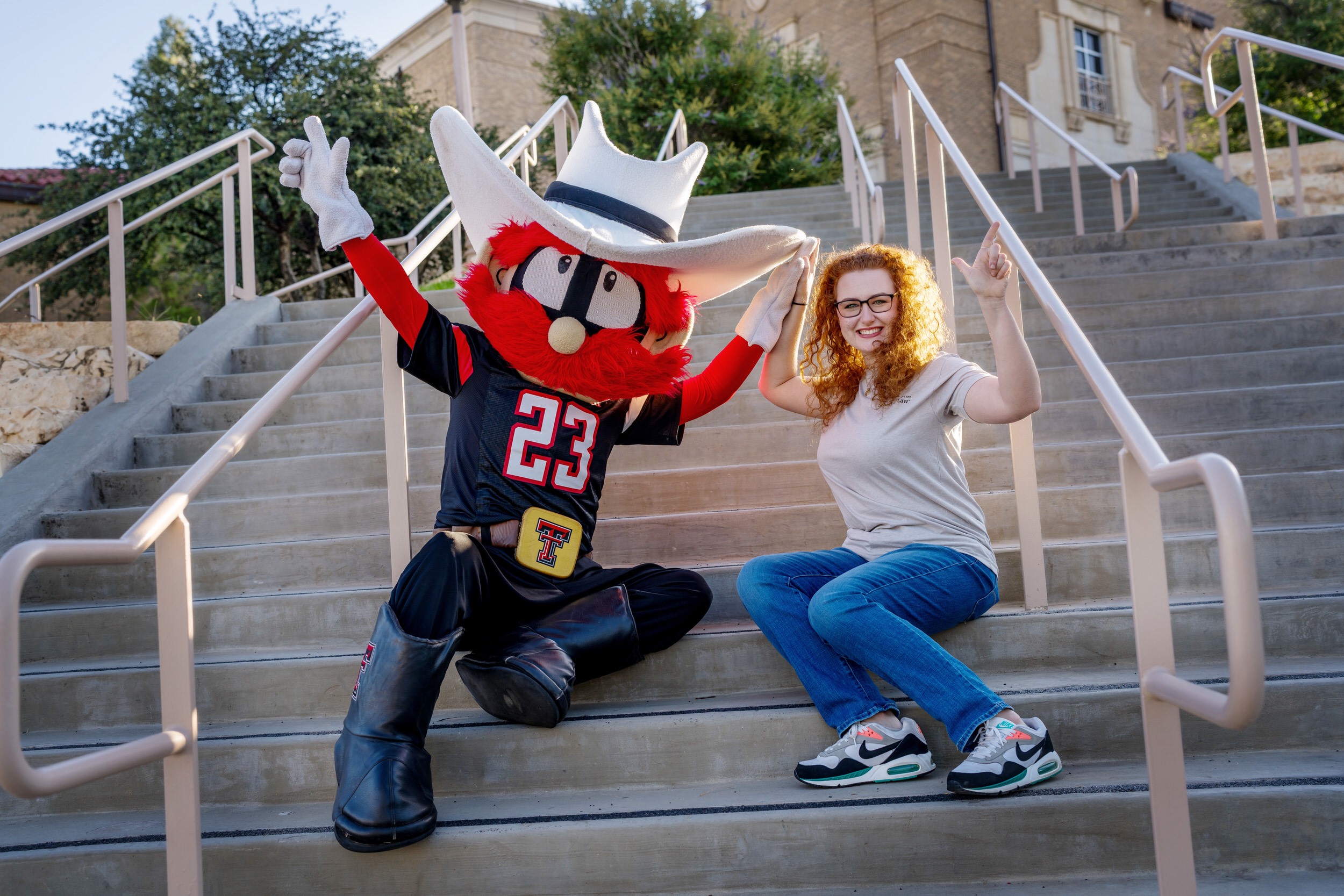 Students laughing with Raider Red