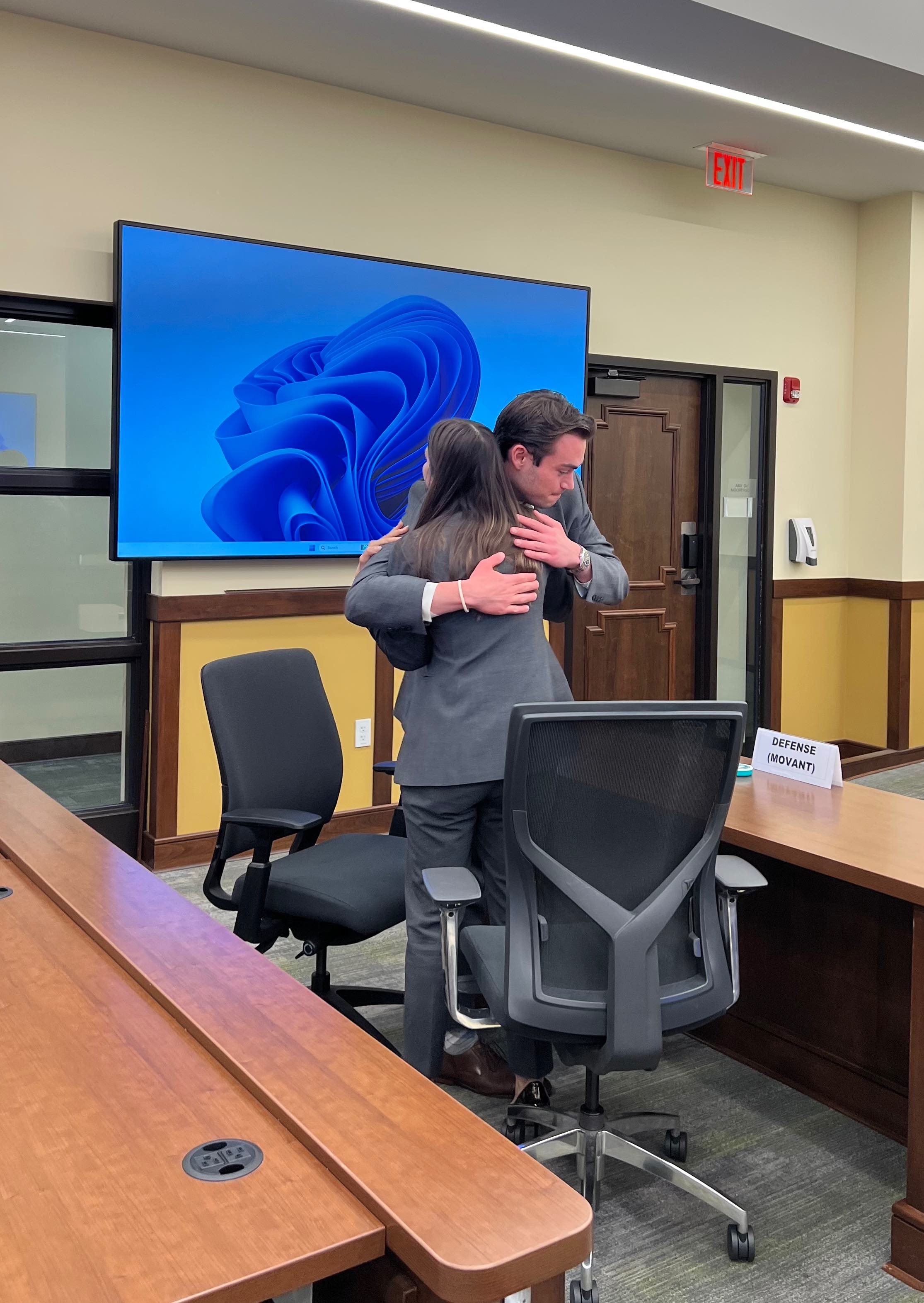 Rachel Behnke and Derek Fisher hugging after the competition.