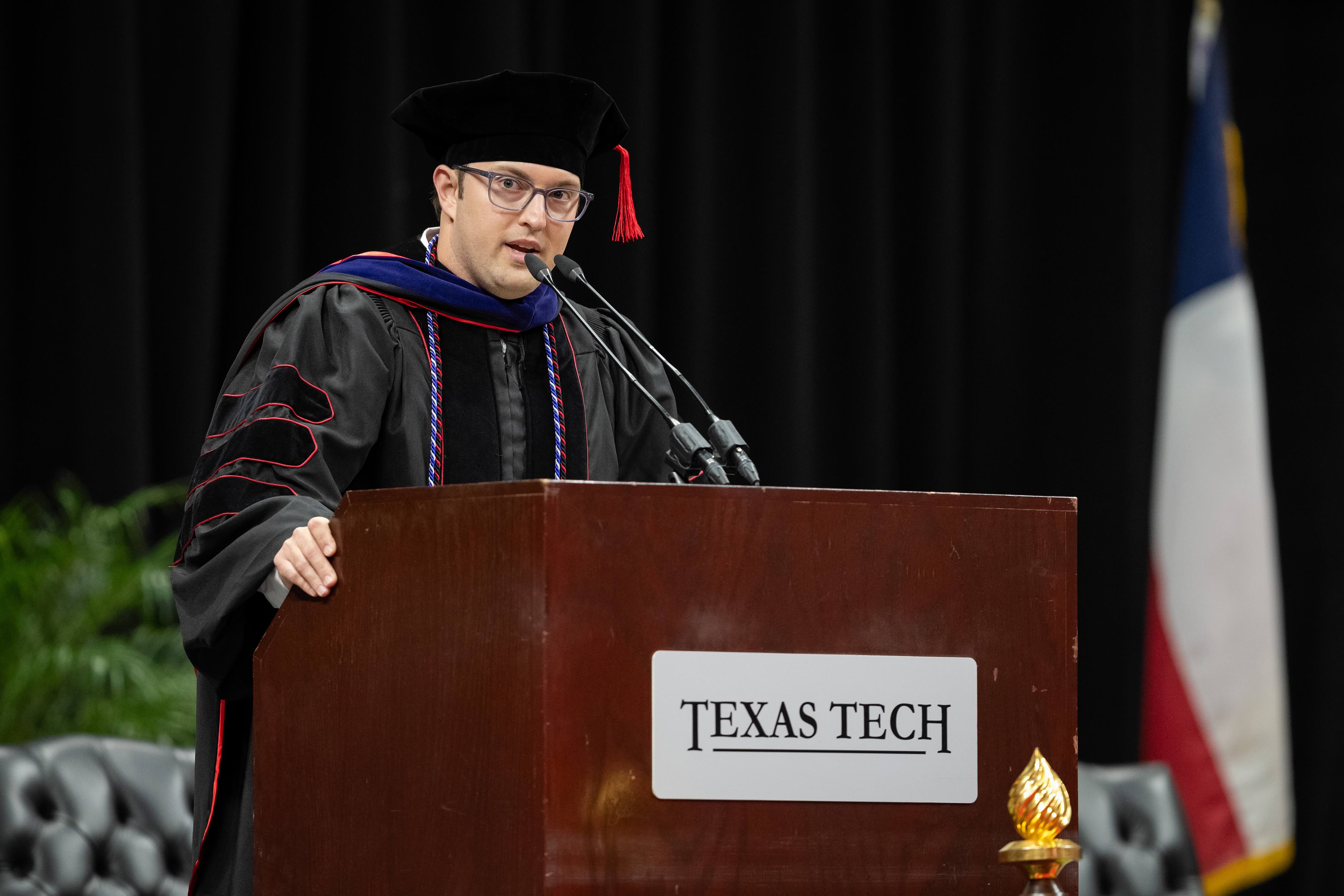 Class-elected speaker Harlan Burk speaks to the crowd