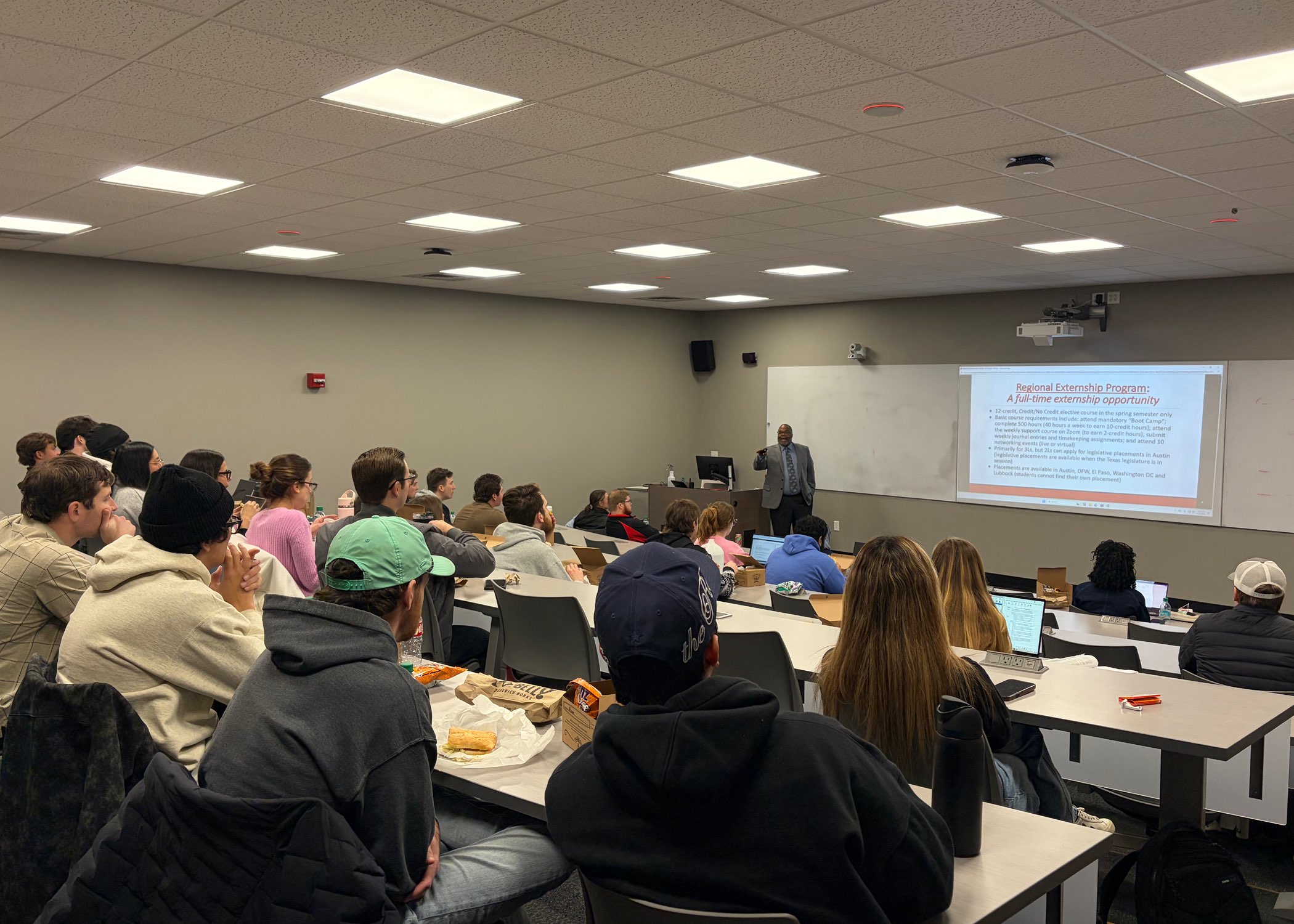 Professor Dwight McDonald speaks to students.