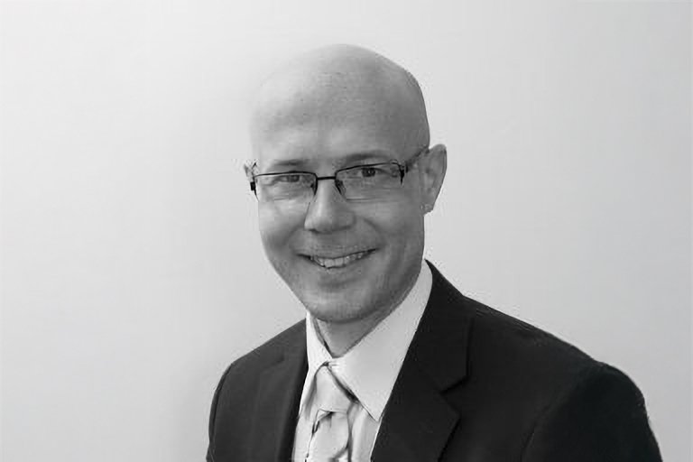 Portrait of Dr. Travis Thompson
