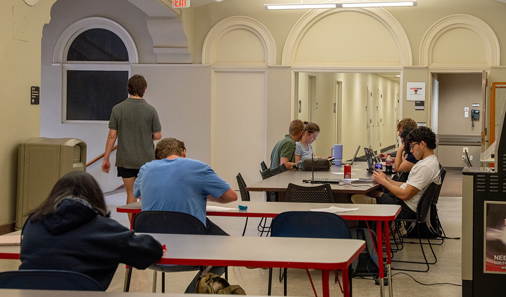 Students studying in the main foyer of the mathematics buildings