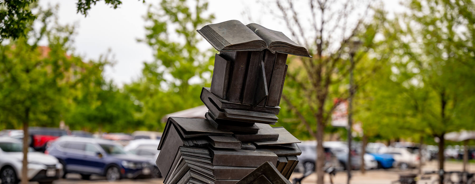 The book man statue outside the Student Union Building and University Library