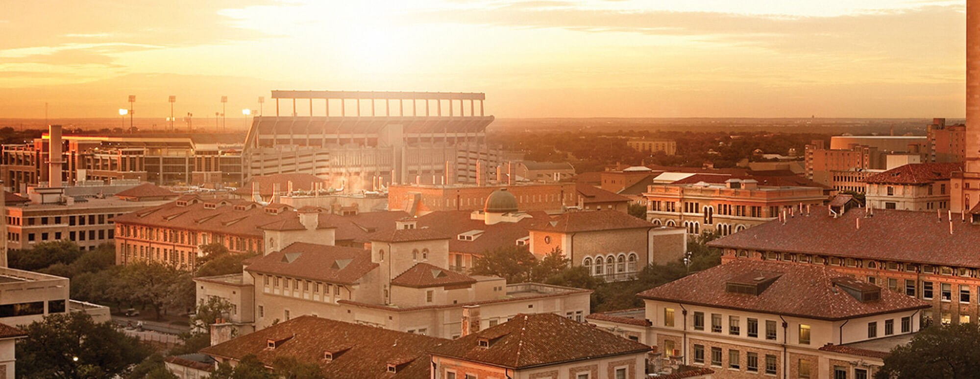 Texas Tech campus at sunset with ATT Stadium in background