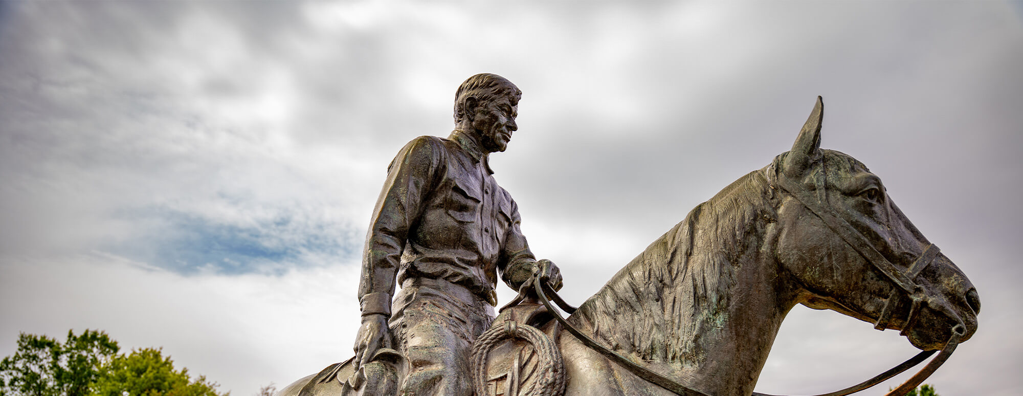 Will Rogers riding Soapsuds on a cloudy day
