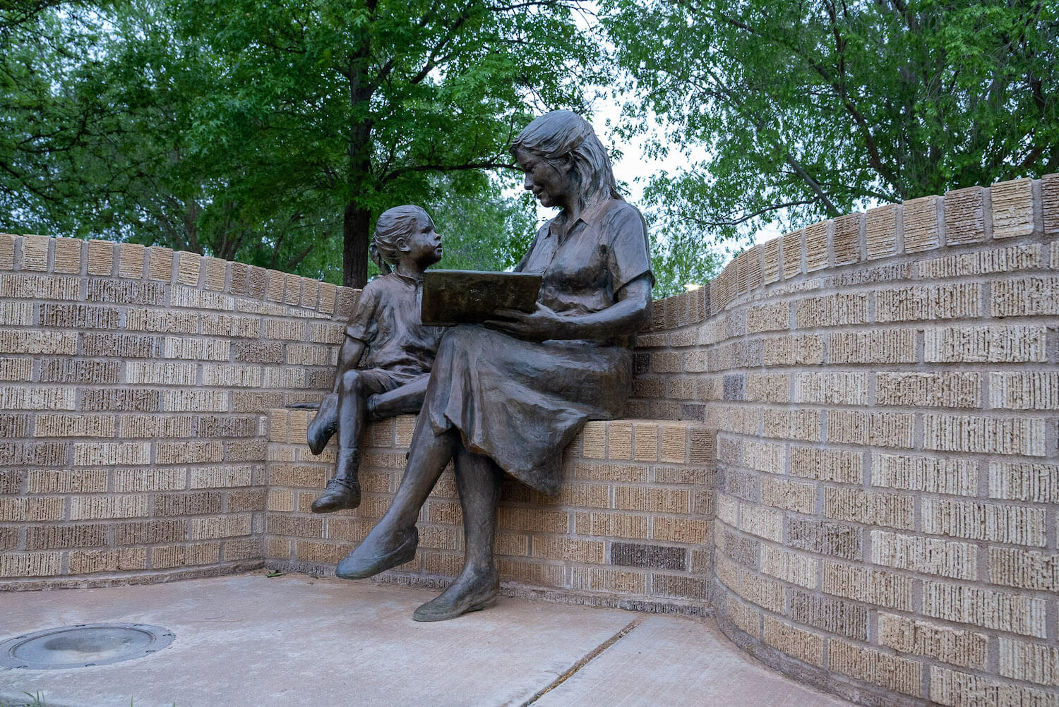 The Glenna Goodacre Mother and Child statue before the College of Health and Human Sciences at Texas Tech