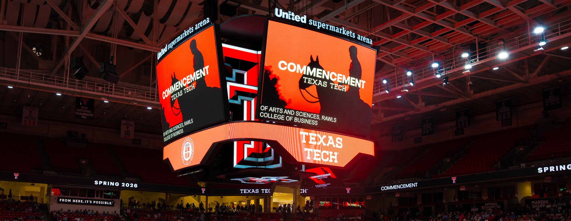 The jumbotron inside the United Sprit Arena during a commencement ceremony