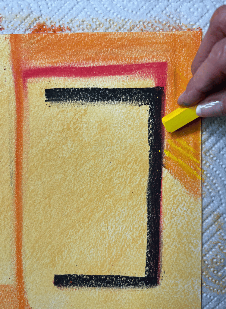 Close up of left side of paper coloring orange and yellow Close up of left side of paper coloring orange and yellow