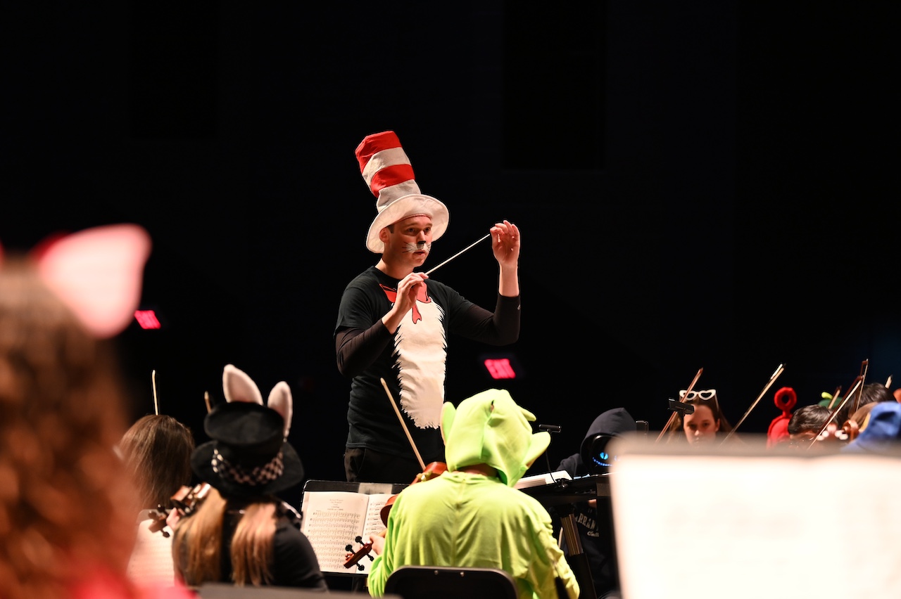 Music conductor in a Cat in the Hat costume