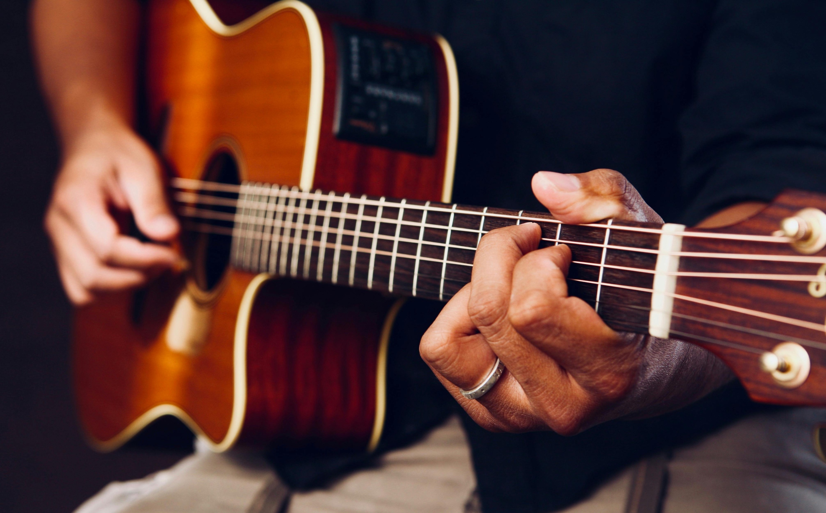 Person playing guitar