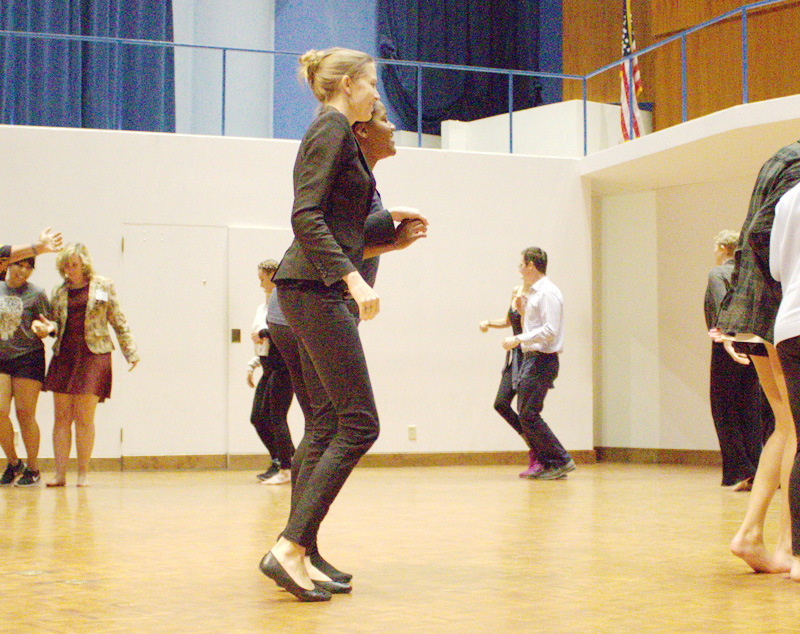 Multiple people dancing in a circle