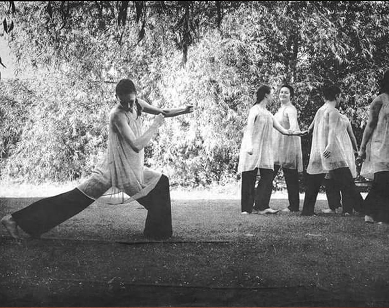 Women outside with one stretching
