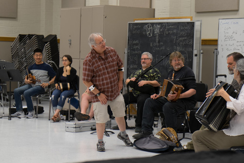 Faculty & students sitting in a circle