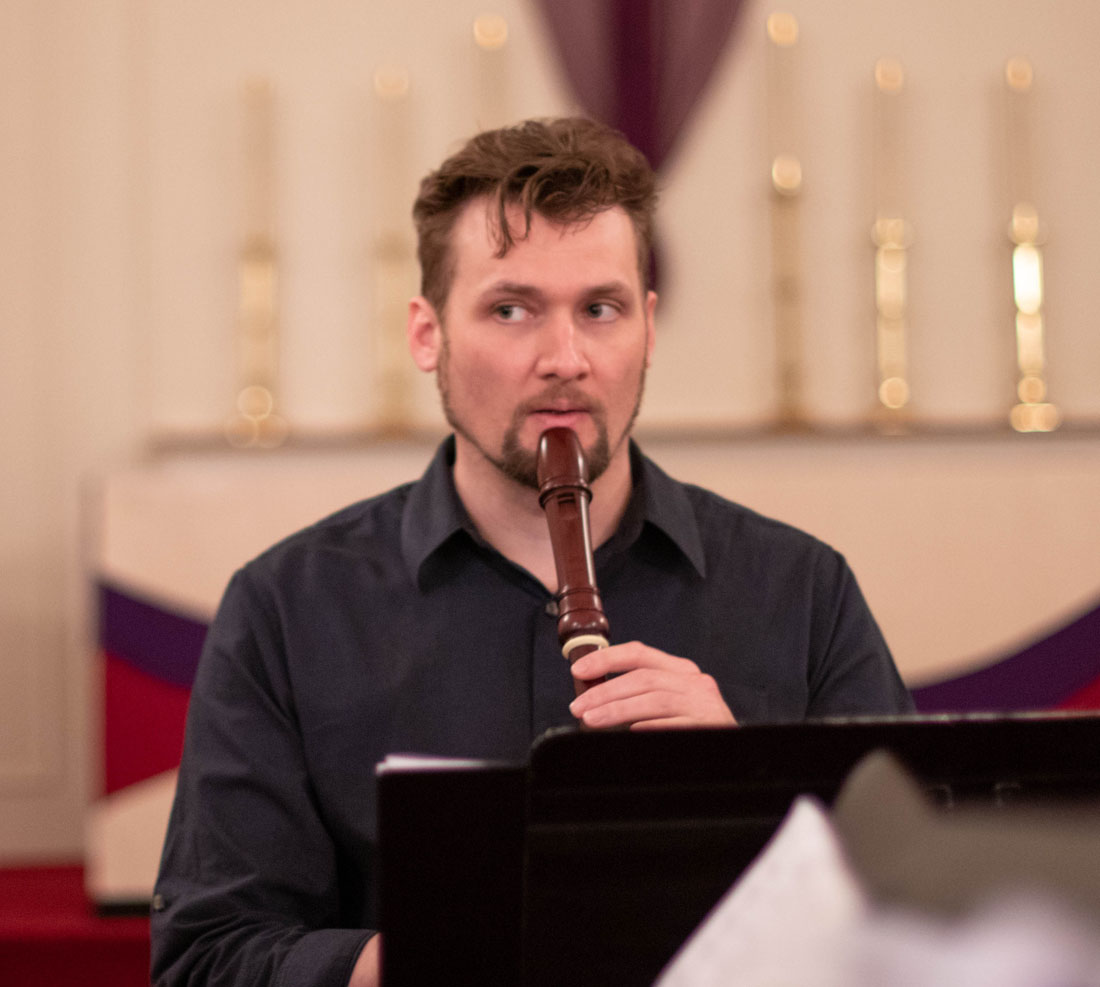TTU Vernacular student playing instrument in a chapel