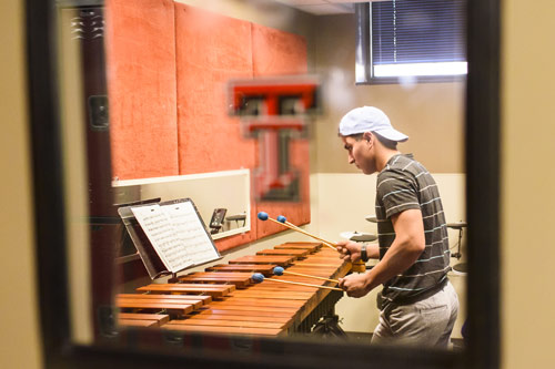 Student playing xylophone