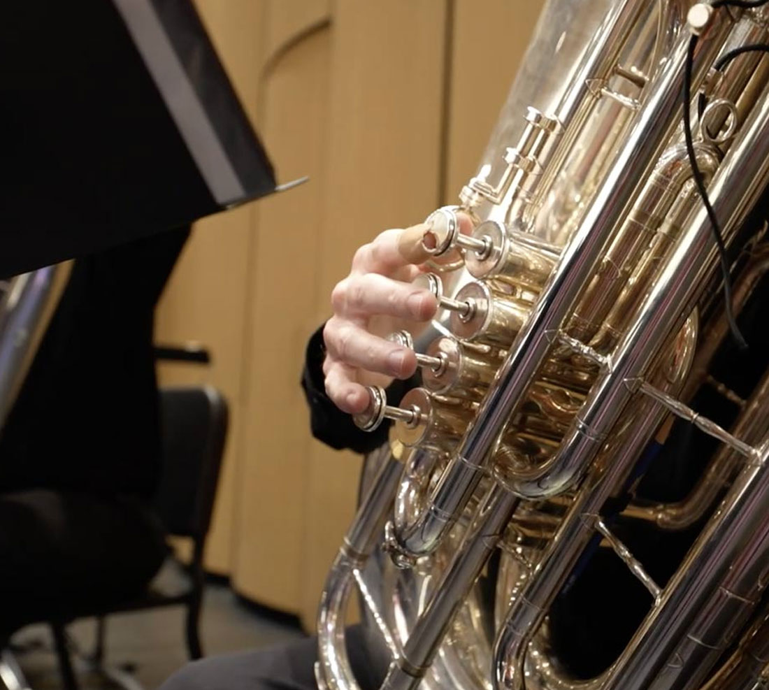 Student playing baritone in orchestra