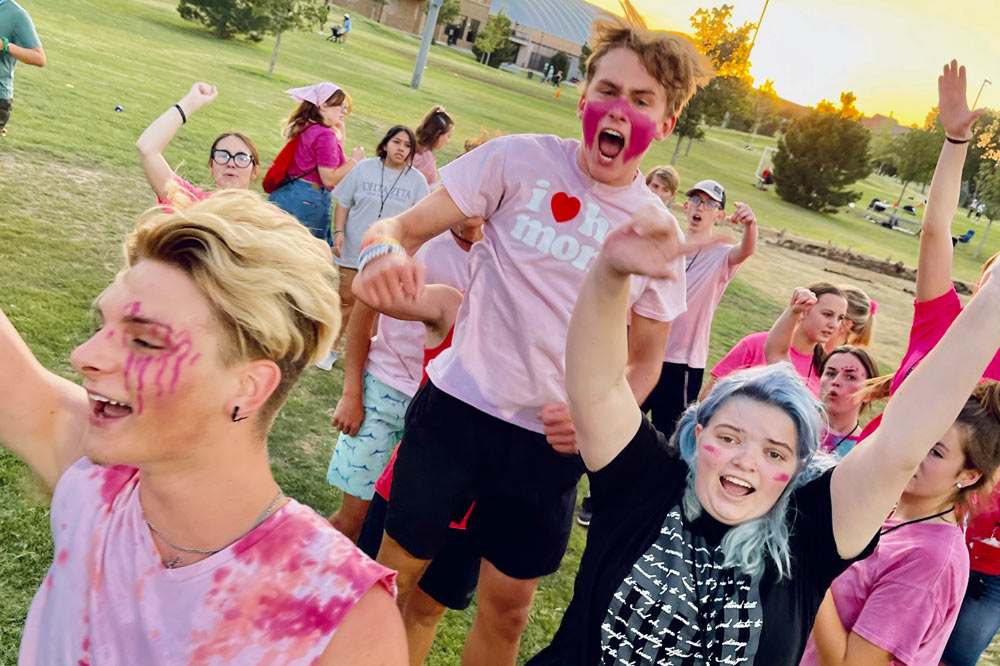 Kids running in the park with faces painted