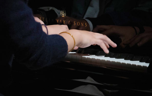 Close-up of TTU Music Student playing piano